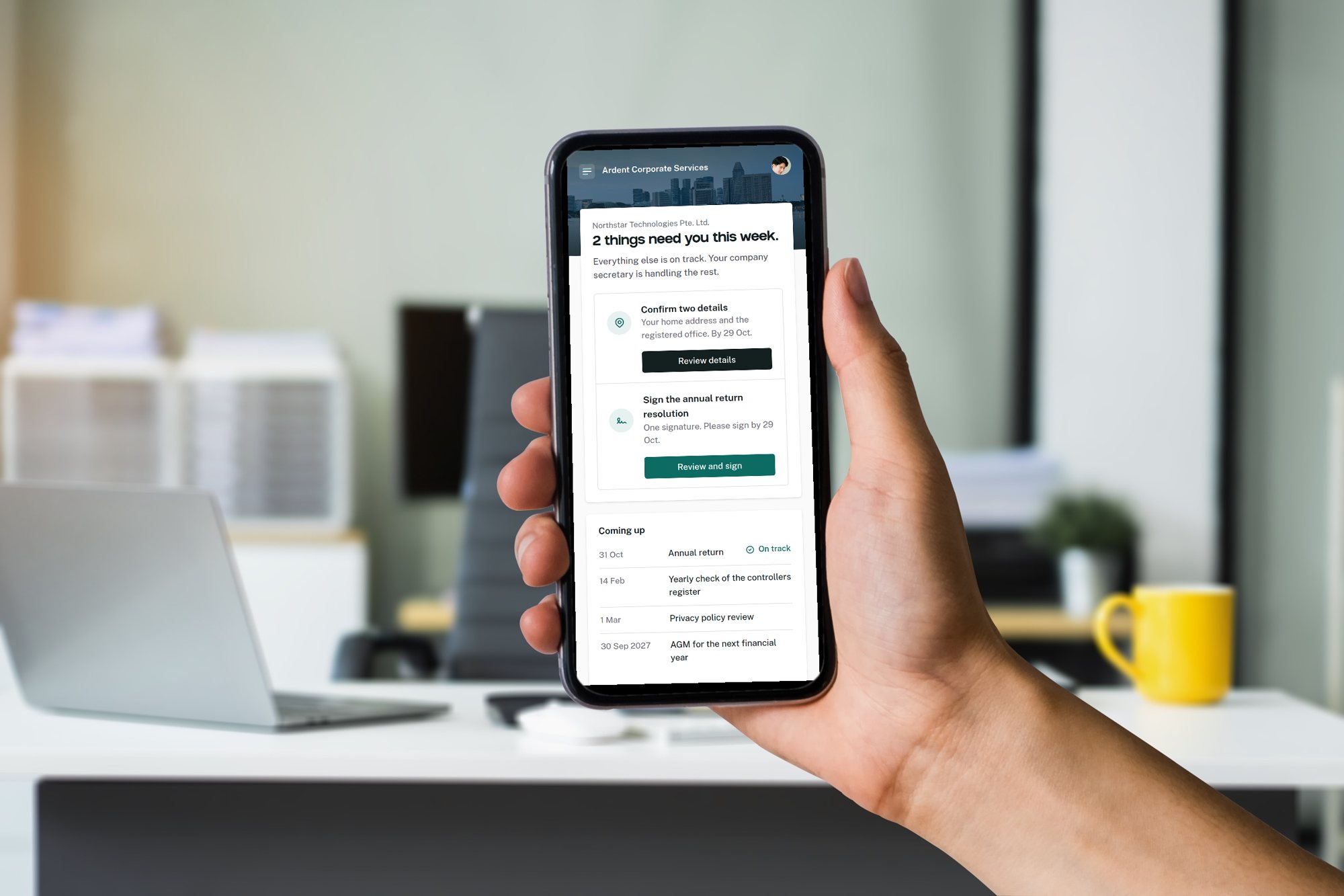 A hand holding a phone showing the client portal. It says two things need you this week: confirm two details, and sign the annual return resolution.
